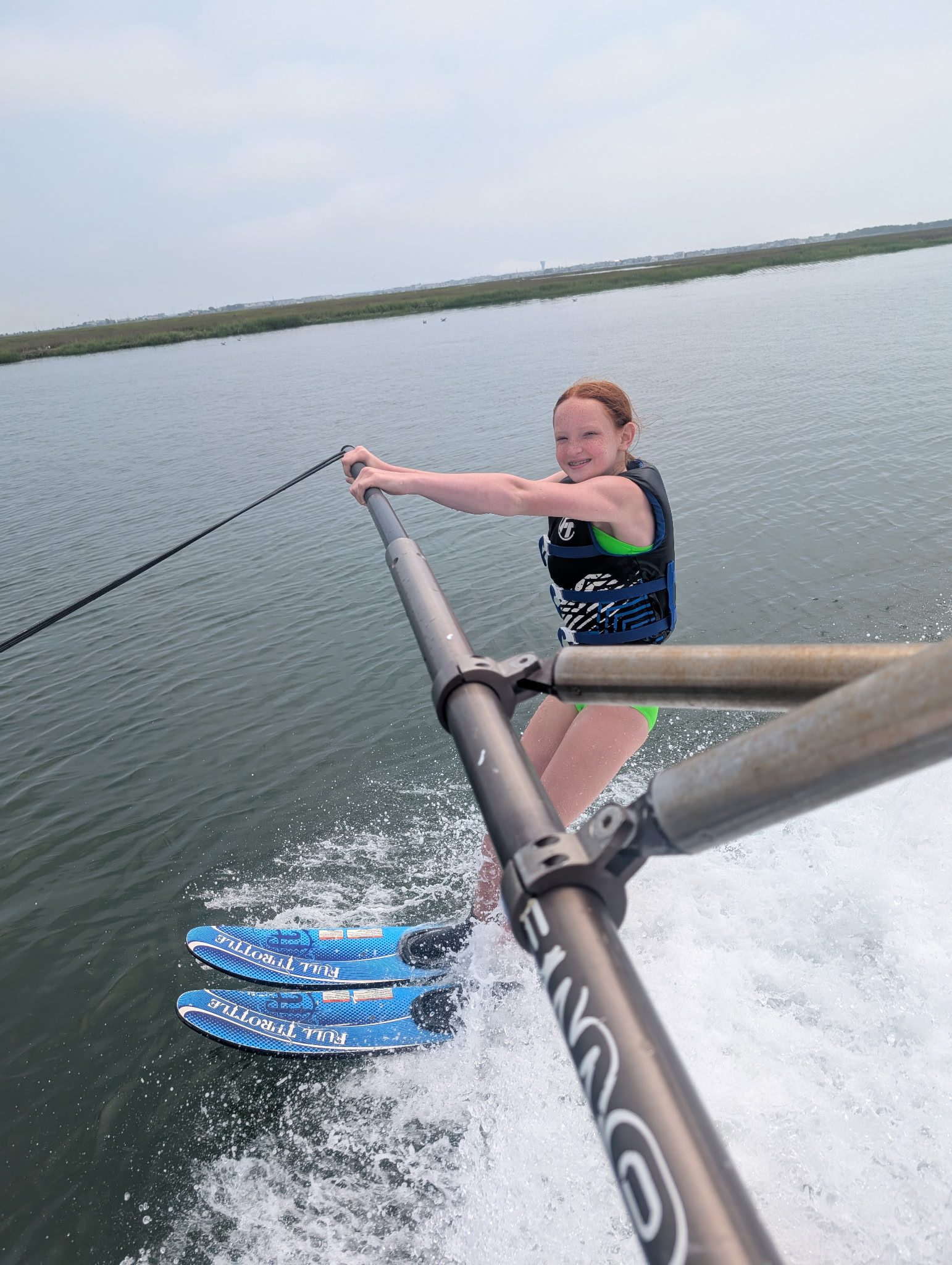 Young guest learning to wakeboard on the boom system at Island Water Sports on the Stone Harbor back bay.