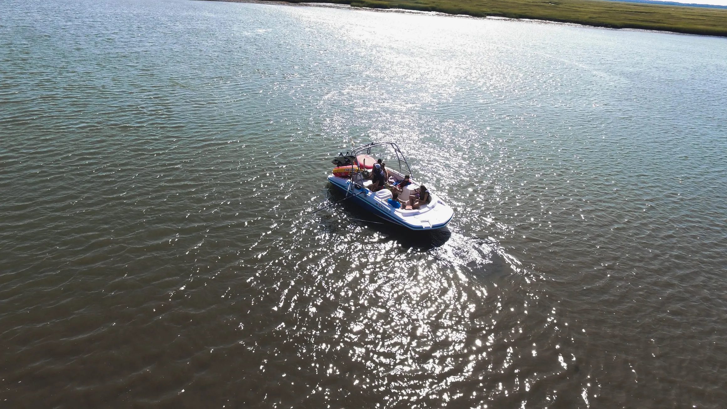 An Island Water Sports ski boat on the back bay in Stone Harbor