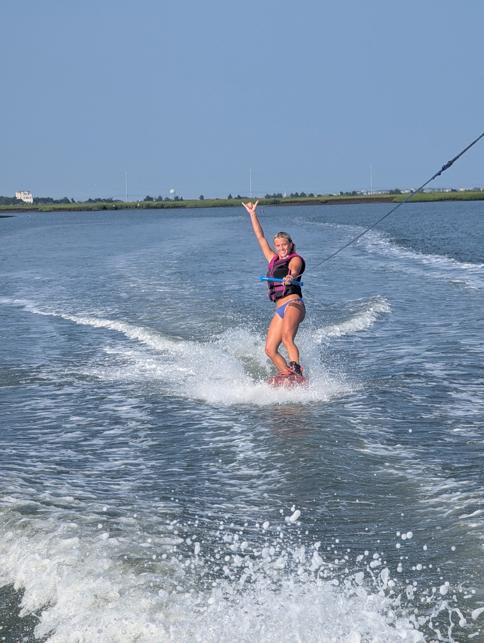 Wakeboarder carving across the Stone Harbor back bay
