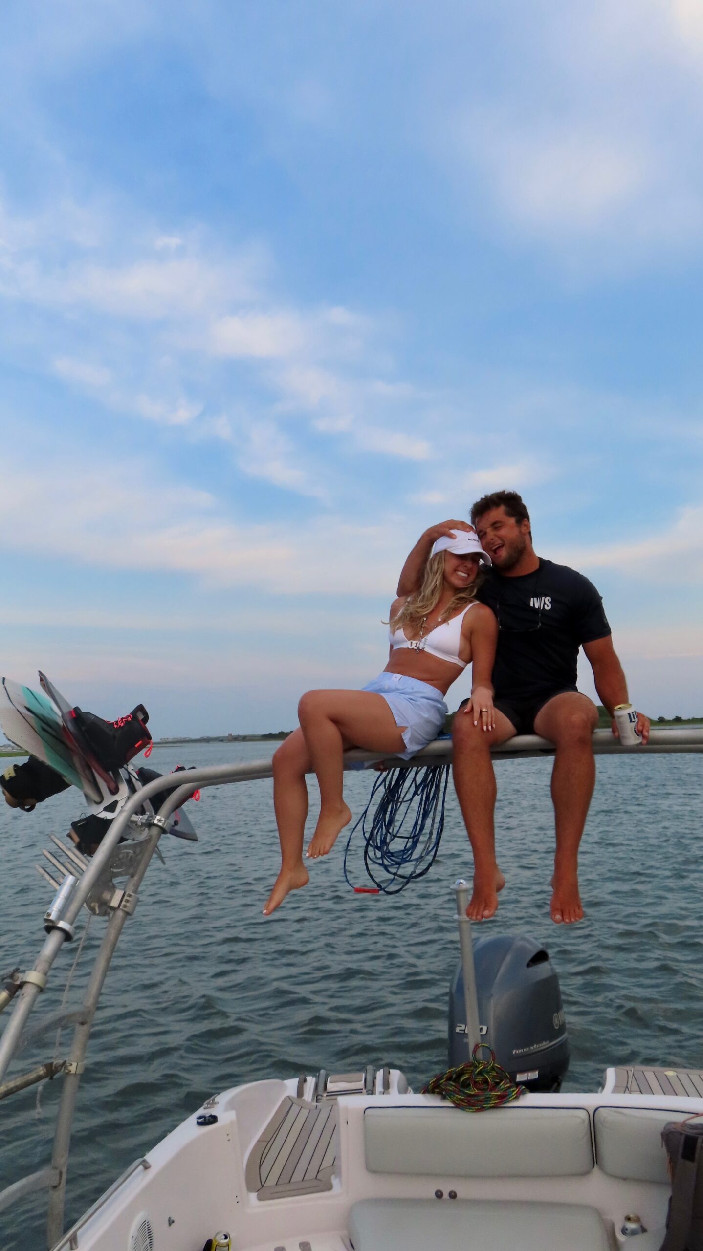 Tommy Tice on an Island Water Sports ski boat at golden hour in the Stone Harbor back bay
