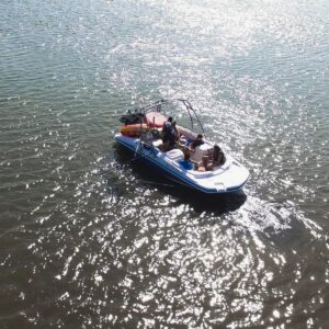 Small group enjoying a day on the water aboard an Island Water Sports boat in the Stone Harbor back bay